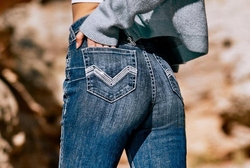 Women in Ariat jeans in desert